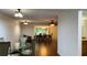 Open-concept dining room with hardwood floors and natural light at 150 El Dorado # 109, Winter Haven, FL 33884