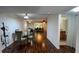 Open-concept dining room adjacent to the kitchen, with hardwood floors at 150 El Dorado # 109, Winter Haven, FL 33884