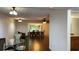 Open-concept dining room with hardwood floors and a view into other living spaces at 150 El Dorado # 109, Winter Haven, FL 33884