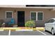 Inviting condo facade with outdoor seating, tidy landscaping, and convenient parking at 150 El Dorado # 109, Winter Haven, FL 33884