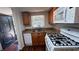 Updated kitchen with granite countertops, stainless steel appliances, and wood-look flooring at 150 El Dorado # 109, Winter Haven, FL 33884