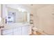 Clean bathroom with a large mirror, vanity, toilet, and walk in shower at 151 Winter Ridge Dr # 151, Winter Haven, FL 33881