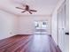 This bedroom features wood floors, closet space, and a sliding door to the outside at 151 Winter Ridge Dr # 151, Winter Haven, FL 33881