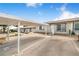 Inviting home exterior featuring a covered parking area and meticulously landscaped front yard at 151 Winter Ridge Dr # 151, Winter Haven, FL 33881