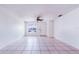 Bright living room with tile flooring, ceiling fan, and natural light from the window at 151 Winter Ridge Dr # 151, Winter Haven, FL 33881