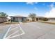 Well-lit parking lot with designated accessible parking in front of the community buildings at 151 Winter Ridge Dr # 151, Winter Haven, FL 33881