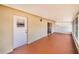 Covered patio with painted floors and a door to the outside at 151 Winter Ridge Dr # 151, Winter Haven, FL 33881