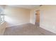 Well-lit bedroom with plush carpeting, window, closet space, and soft neutral color palette at 1550 11Th Ne St # E7, Winter Haven, FL 33881