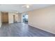 Bright living room with wood-look floors and sliding doors to the balcony at 1550 11Th Ne St # E7, Winter Haven, FL 33881