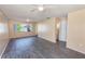 Spacious living room with wood-look flooring and lots of natural light at 1550 11Th Ne St # E7, Winter Haven, FL 33881