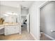 Bright bathroom featuring tile floors, and single sink vanity at 157 Walkers Point Dr, Auburndale, FL 33823