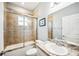 Bathroom featuring a shower over bath, single sink vanity, and mirror at 157 Walkers Point Dr, Auburndale, FL 33823
