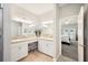Bright bathroom featuring tile floors, dual sinks, and a vanity at 157 Walkers Point Dr, Auburndale, FL 33823