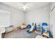 Spacious bedroom with ample play space and a variety of colorful toys and -friendly furnishings at 157 Walkers Point Dr, Auburndale, FL 33823