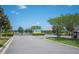 Entrance to Juliana Village featuring a decorative sign and gated access at 157 Walkers Point Dr, Auburndale, FL 33823
