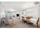 Open-concept dining room with carpet and view to living room at 157 Walkers Point Dr, Auburndale, FL 33823