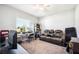 Living room features a window, desk, chair, and theater seating at 157 Walkers Point Dr, Auburndale, FL 33823