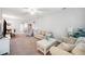 Spacious living room featuring neutral tones, cozy seating, and an inviting atmosphere, perfect for Gathering and guests at 157 Walkers Point Dr, Auburndale, FL 33823