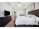 Spacious main bedroom with tray ceiling, carpeted floor, and a large dresser at 157 Walkers Point Dr, Auburndale, FL 33823