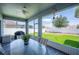 Screened-in patio with outdoor dining set overlooking a well-maintained backyard at 157 Walkers Point Dr, Auburndale, FL 33823