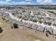 An aerial view of community homes near a lake, showcasing residential charm at 180 Grove Branch Rd, Winter Haven, FL 33880