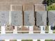 Aerial view highlighting the property lines, roof details, and landscaping of a home in a neatly arranged neighborhood at 180 Grove Branch Rd, Winter Haven, FL 33880