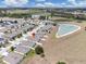 Aerial view pinpoints a house in a residential area with a lake and pond at 180 Grove Branch Rd, Winter Haven, FL 33880