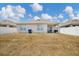 View of the backyard featuring a lawn and a privacy fence at 180 Grove Branch Rd, Winter Haven, FL 33880