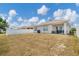 The backyard has a fence and patio at 180 Grove Branch Rd, Winter Haven, FL 33880