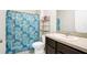 The bathroom has a shower, toilet, vanity and mirror at 180 Grove Branch Rd, Winter Haven, FL 33880