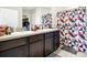 Bathroom with double vanity sinks, ample counter space, and a stylish shower curtain at 180 Grove Branch Rd, Winter Haven, FL 33880