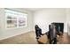 Bright bedroom featuring a large window and cozy carpeting at 180 Grove Branch Rd, Winter Haven, FL 33880