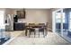 Relaxing dining area with ample natural light and a sliding glass door leading to outdoor living at 180 Grove Branch Rd, Winter Haven, FL 33880