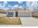 Charming single-story home with a well-maintained lawn and inviting curb appeal at 180 Grove Branch Rd, Winter Haven, FL 33880