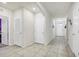 Hallway featuring tile flooring and several doors leading to other rooms at 180 Grove Branch Rd, Winter Haven, FL 33880
