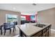Modern kitchen with a view to the dining and living spaces at 180 Grove Branch Rd, Winter Haven, FL 33880