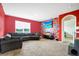 Inviting living room featuring an accent wall, plush seating, and a TV for entertainment at 180 Grove Branch Rd, Winter Haven, FL 33880