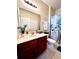 Bright bathroom with a vanity, fresh towels, and a decorative shower curtain at 1820 Coriander Dr, Poinciana, FL 34759