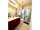 Clean and well-maintained bathroom with a vanity and coordinated decor at 1820 Coriander Dr, Poinciana, FL 34759