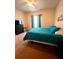 Inviting bedroom with a view to the outside, featuring carpet and nice decor at 1820 Coriander Dr, Poinciana, FL 34759