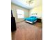Cozy bedroom with a ceiling fan, a comfortable bed, and natural light at 1820 Coriander Dr, Poinciana, FL 34759