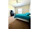Well lit bedroom with a comfortable bed and ample space at 1820 Coriander Dr, Poinciana, FL 34759
