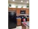 Modern kitchen with stainless steel appliances and ample counter space at 1820 Coriander Dr, Poinciana, FL 34759