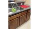 Double basin stainless steel kitchen sink with gray countertops at 1820 Coriander Dr, Poinciana, FL 34759
