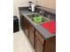 Kitchen area with a stainless steel sink and gray countertop at 1820 Coriander Dr, Poinciana, FL 34759