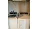 Well-equipped laundry room with a modern washer and dryer at 1820 Coriander Dr, Poinciana, FL 34759