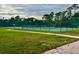 Well maintained tennis court with green surroundings and a peaceful atmosphere at 1820 Coriander Dr, Poinciana, FL 34759