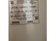 Close up of water heater serial number and product information at 1820 Coriander Dr, Poinciana, FL 34759