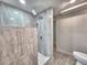 Modern tiled shower with updated shower-head and fixtures at 1919 19Th Nw St, Winter Haven, FL 33881