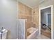 Bathroom featuring bathtub and decorative tile design at 1919 19Th Nw St, Winter Haven, FL 33881